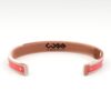 Bracciale in rame di colore rosso con logo ingrandito (retro)